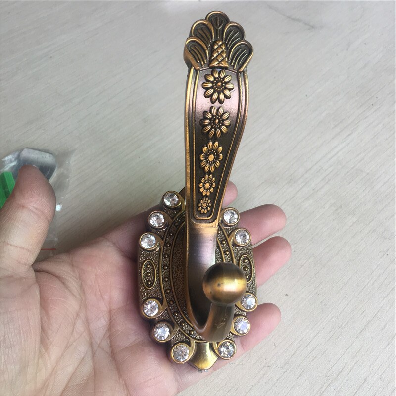 

Антикварный крючок для халата, бронза